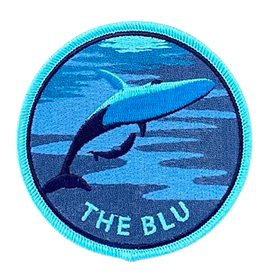 blue circle embroidered patch with whale design