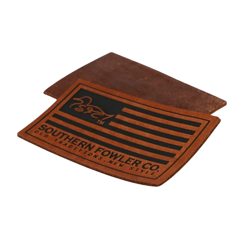 brown rectangular leather patch with debossed American flag design