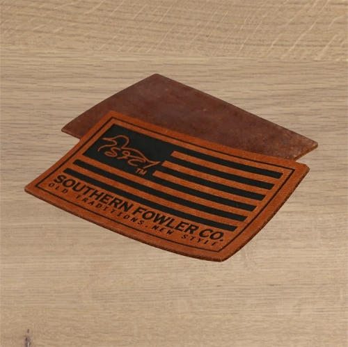 brown rectangular leather patch with debossed American flag design