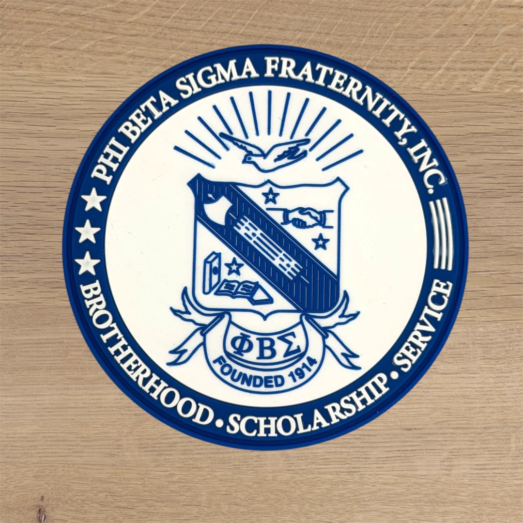 blue and white PVC circle patch with fraternity crest