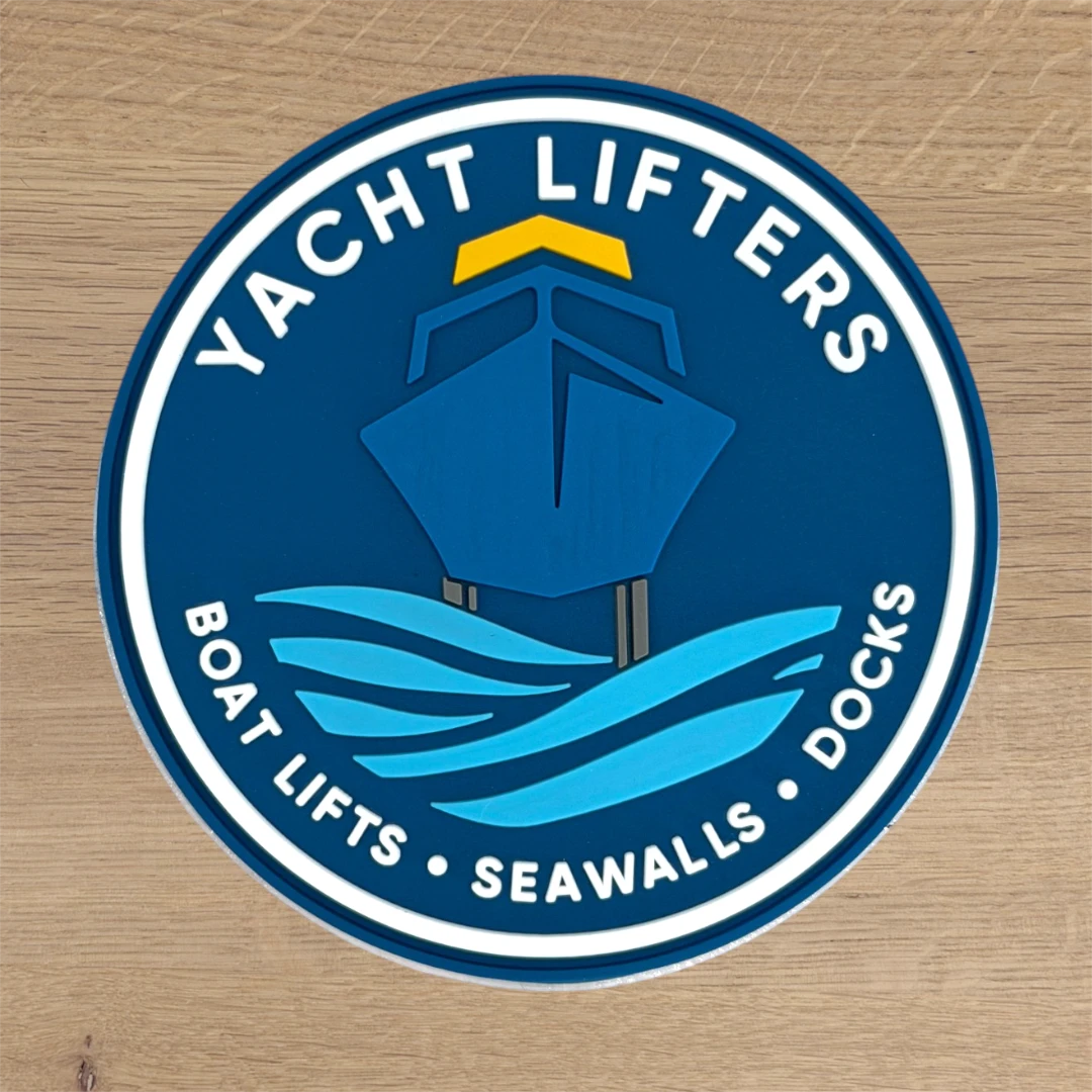 navy PVC circle patch with boat and waves marine logo