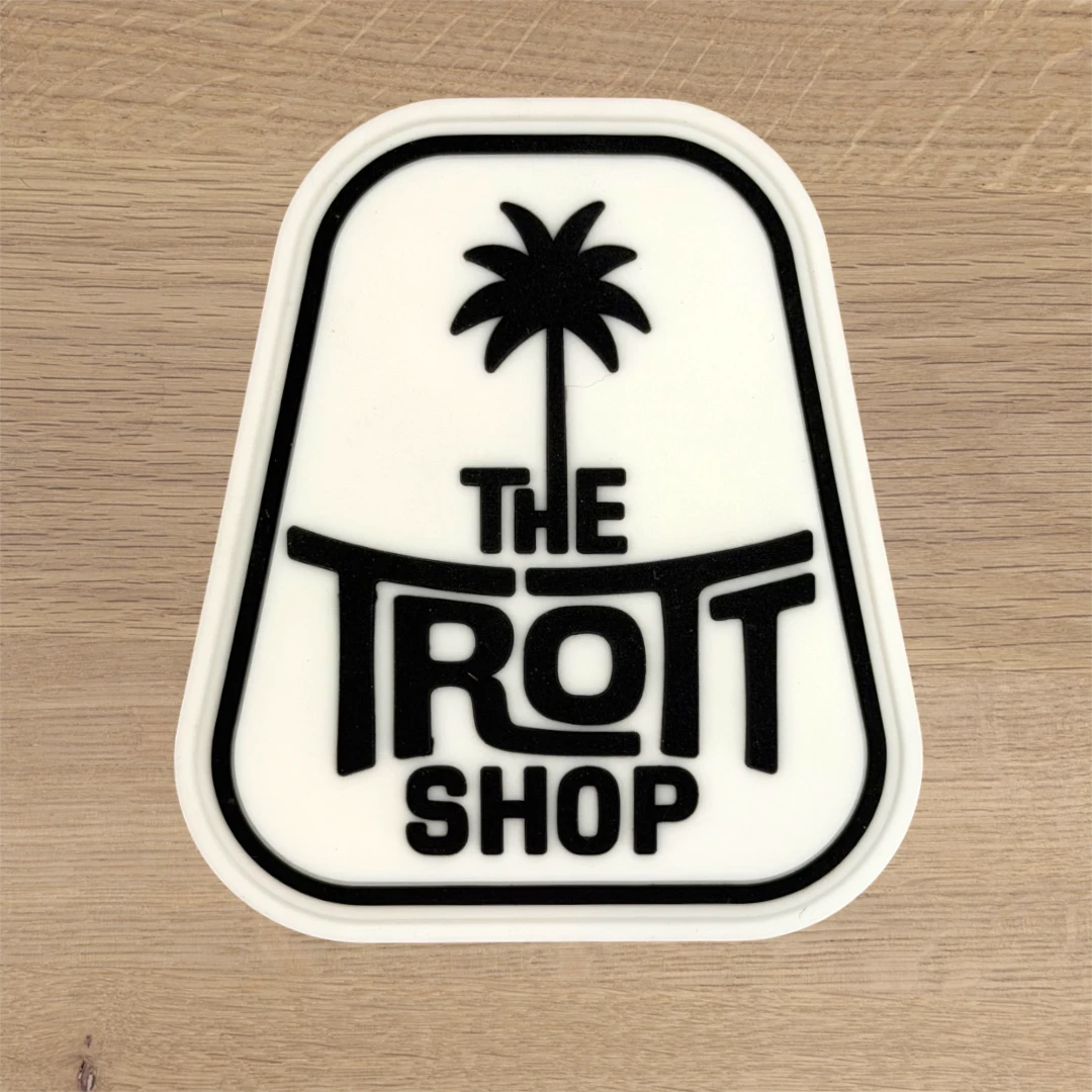white custom shape PVC patch with palm tree shop logo
