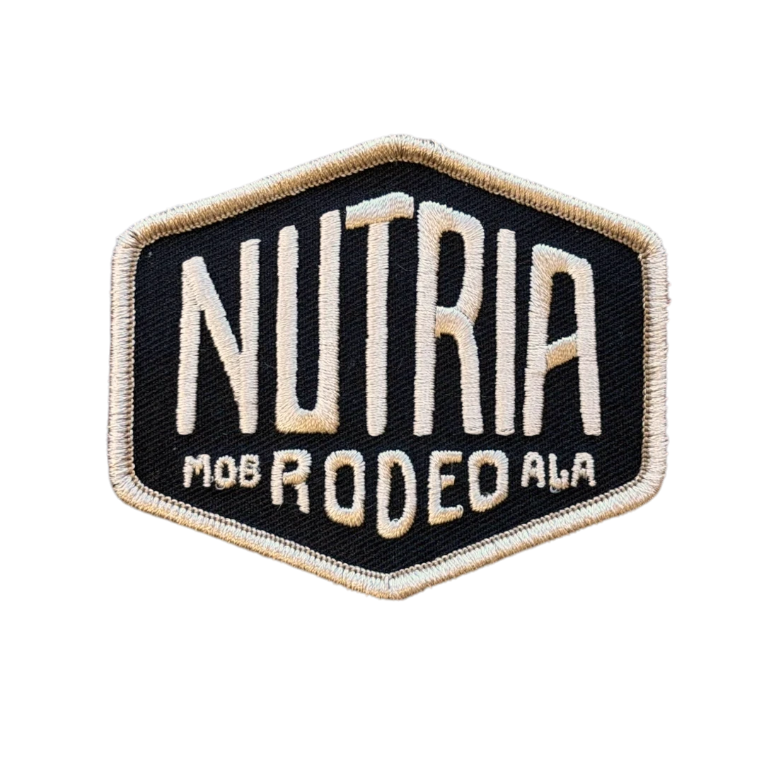 black hexagon embroidered patch with white text logo