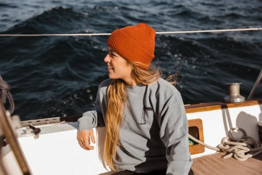 girl wearing custom cuff beanie on boat