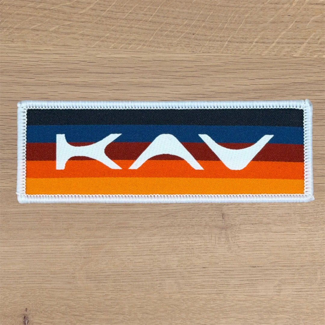 narrow rectangle woven patch with retro stripe design and white border