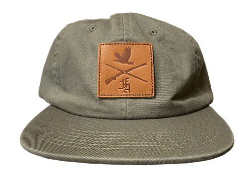 square leather patch with hunting design on olive green dad hat