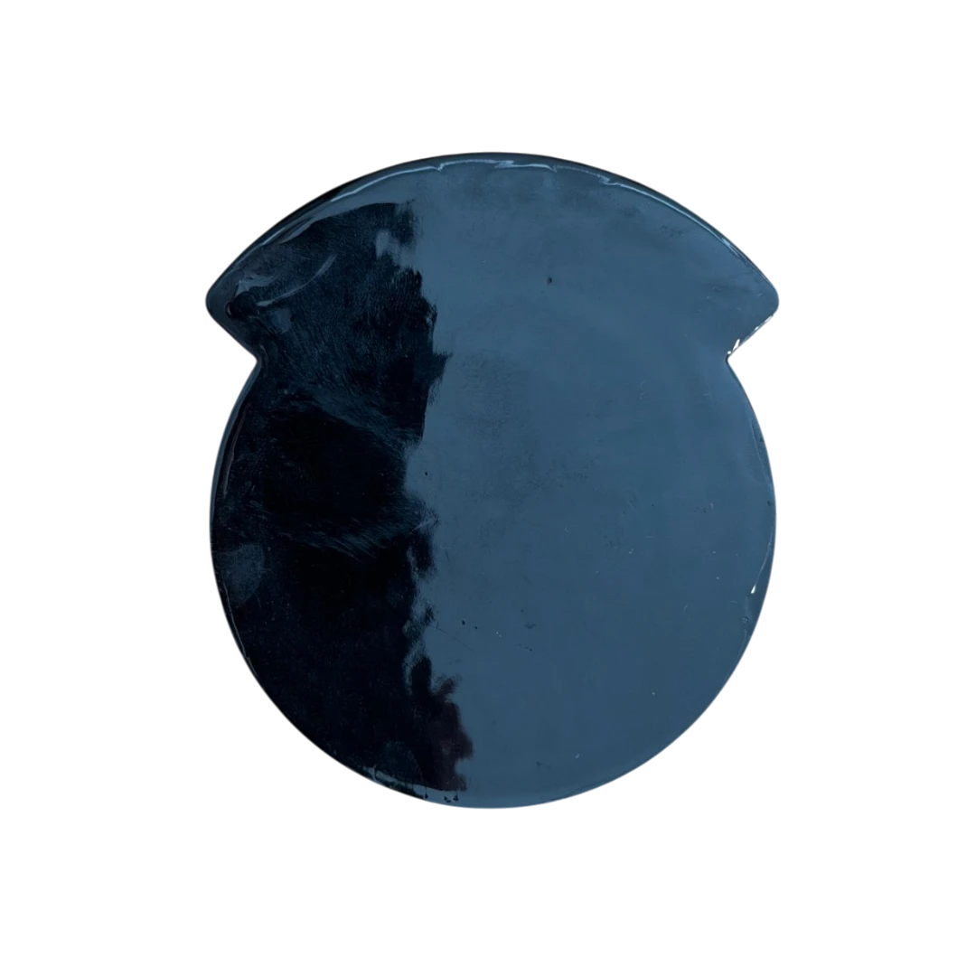 smooth back of a black PVC patch with no backing