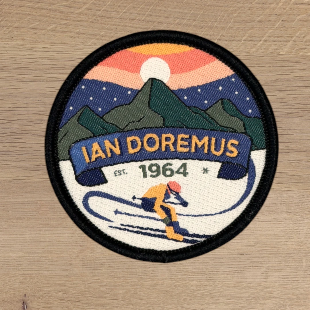 circle woven patch with detailed retro ski scene design