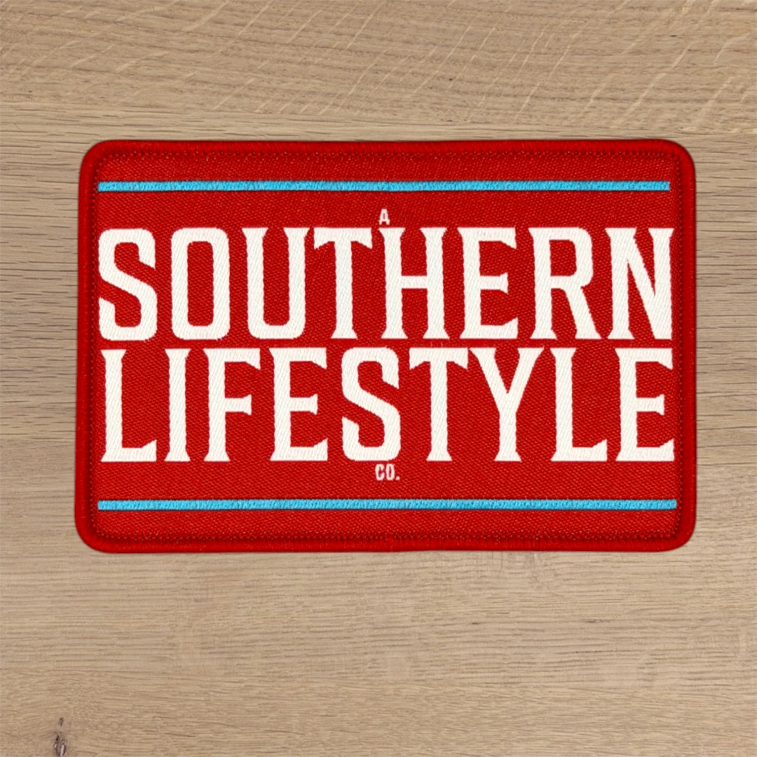red rectangle woven patch with white block lettering