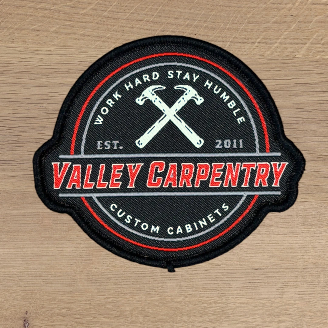 custom shape woven patch with carpentry badge design and crossed hammers
