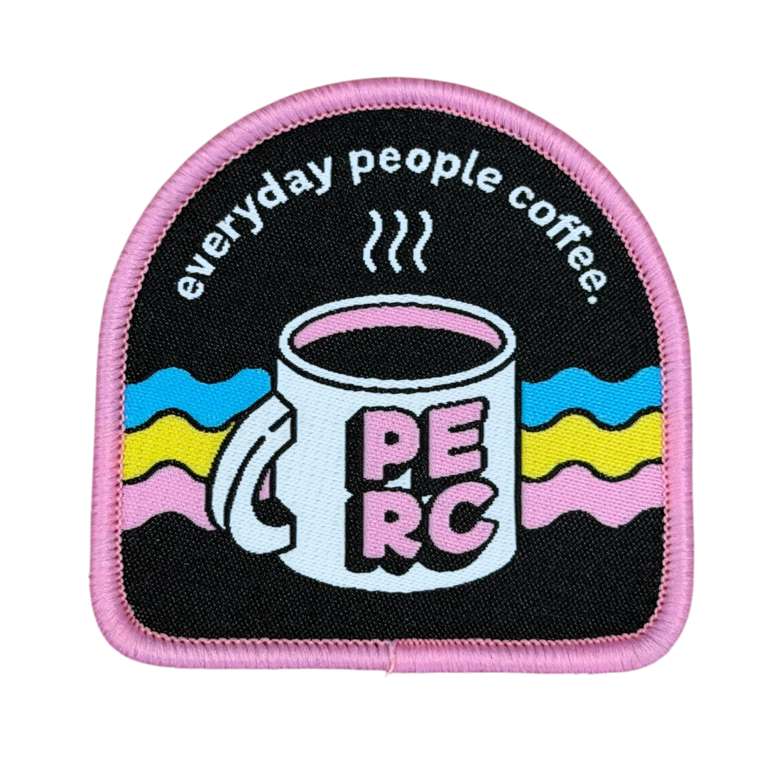 arch shaped woven patch with coffee mug design and pink border